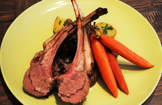 Smoked Rack of Lamb on plate with carrots and potatoes for Easter Dinner