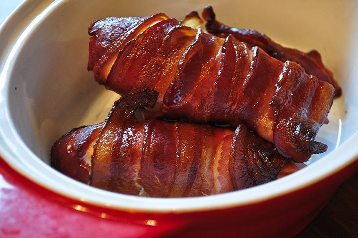 Smoked bacon wrapped chicken in a bowl